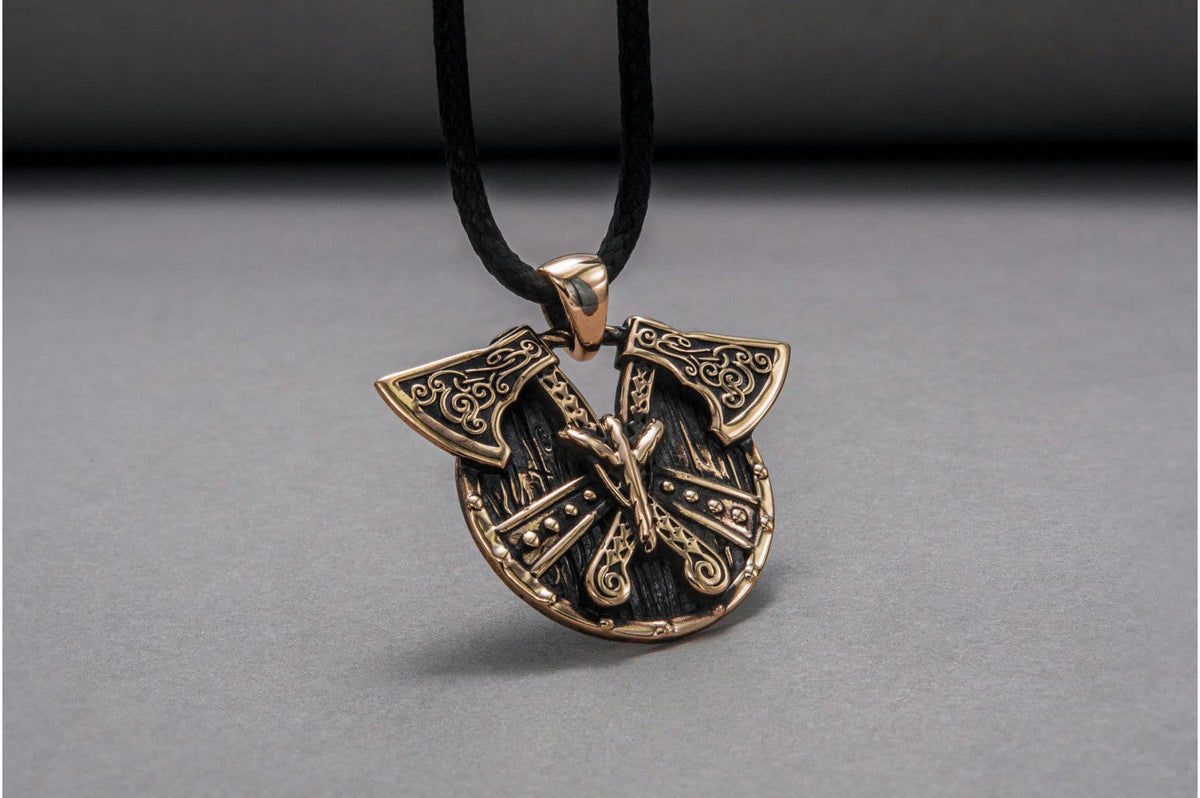 Pendentif Bouclier et Haches — Bronze